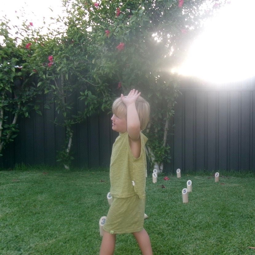 Ari wearing Summer Knit Short in Treehouse Stripe. Age 3 • Wearing 4-5Y