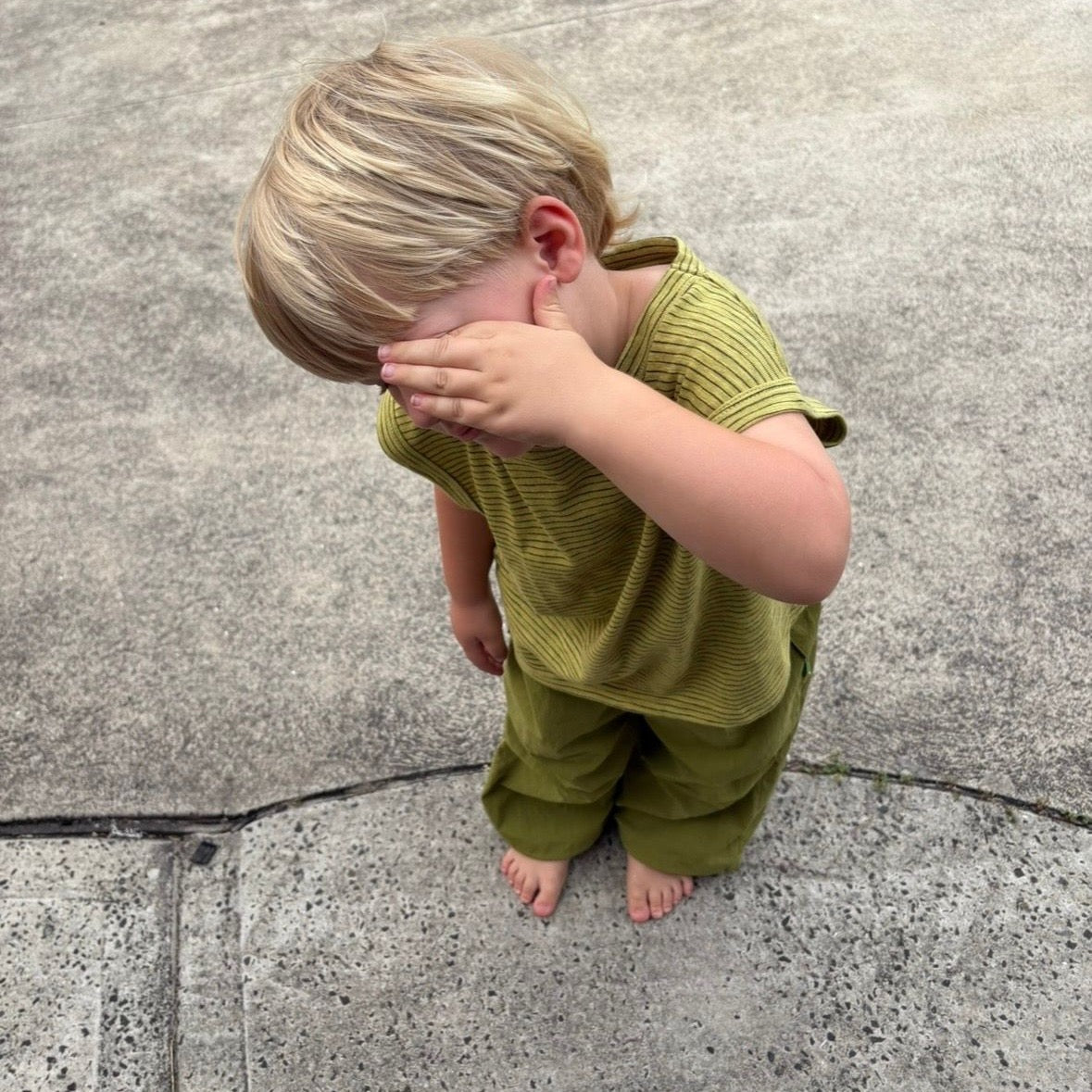 Ari wearing Tech Pant in Sprout. Age 3 • Wearing 4-5Y