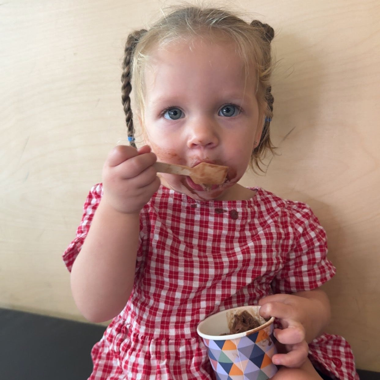 Isabel wearing Poppy Capri in Ruby Check. Age 12-18m • Wearing 6-12m