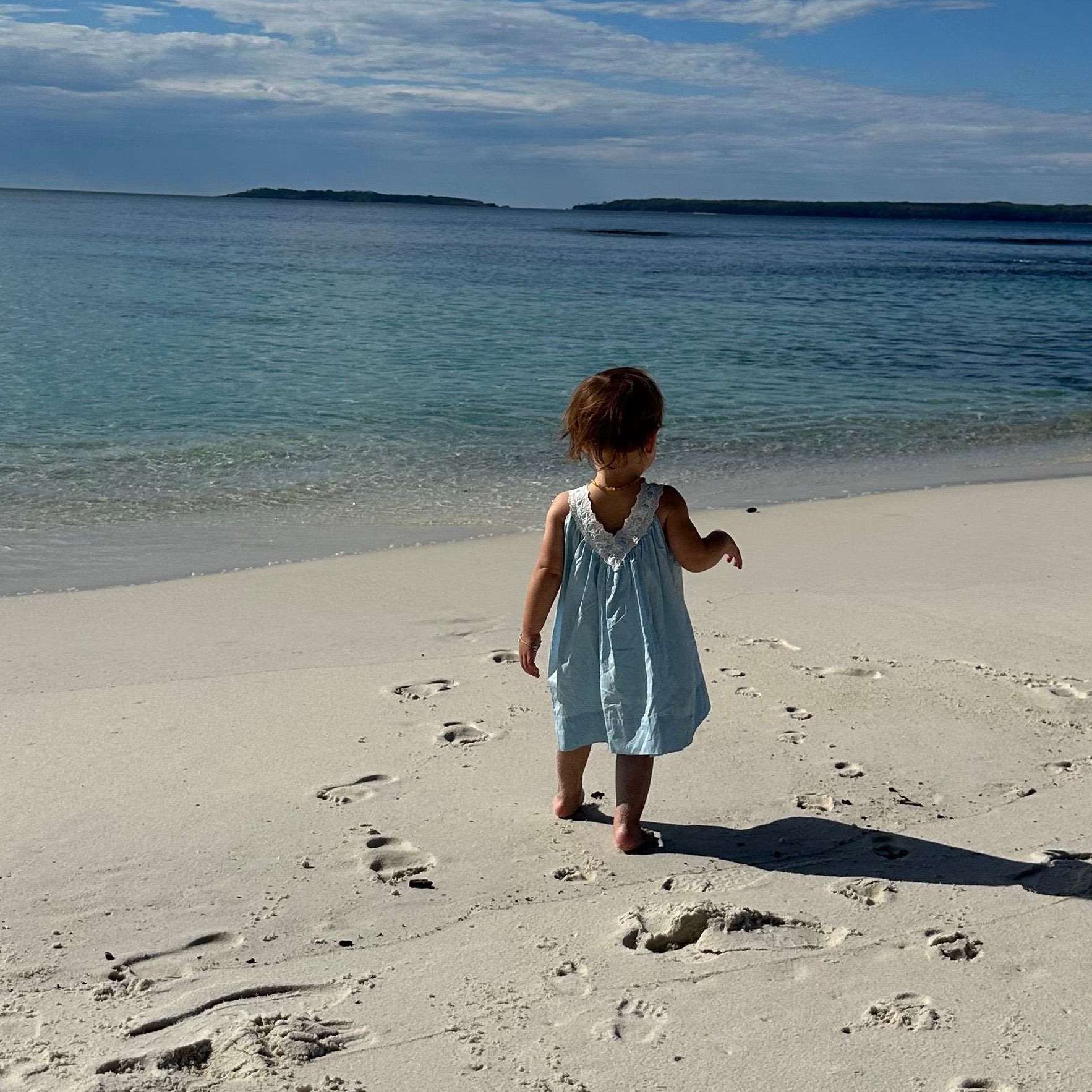Lola wearing Polly Dress in Float. Age 2 • Wearing 12-18m