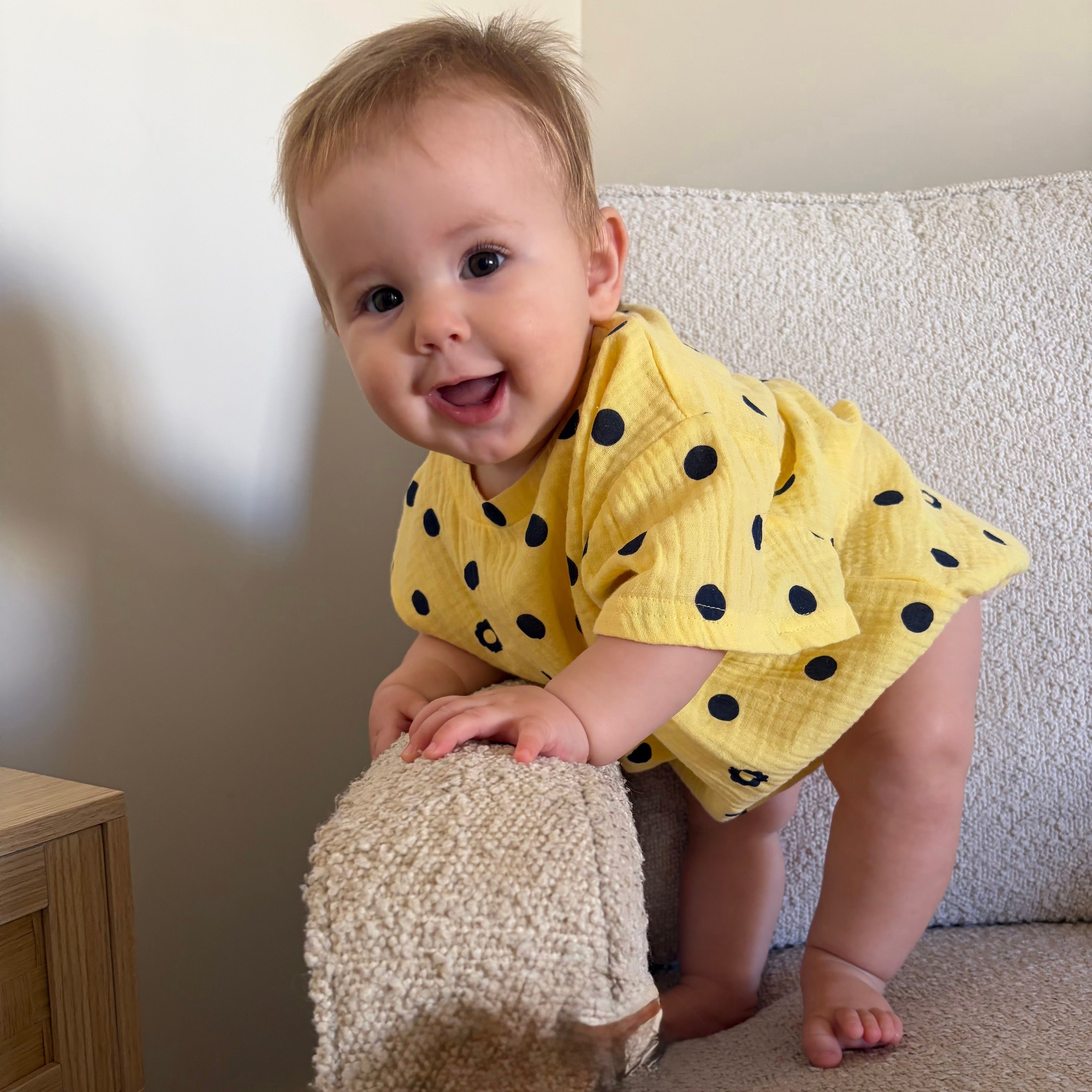 Raya wearing Vivi Romper in Butter Dot. Age 6-12m • Wearing 12-18m