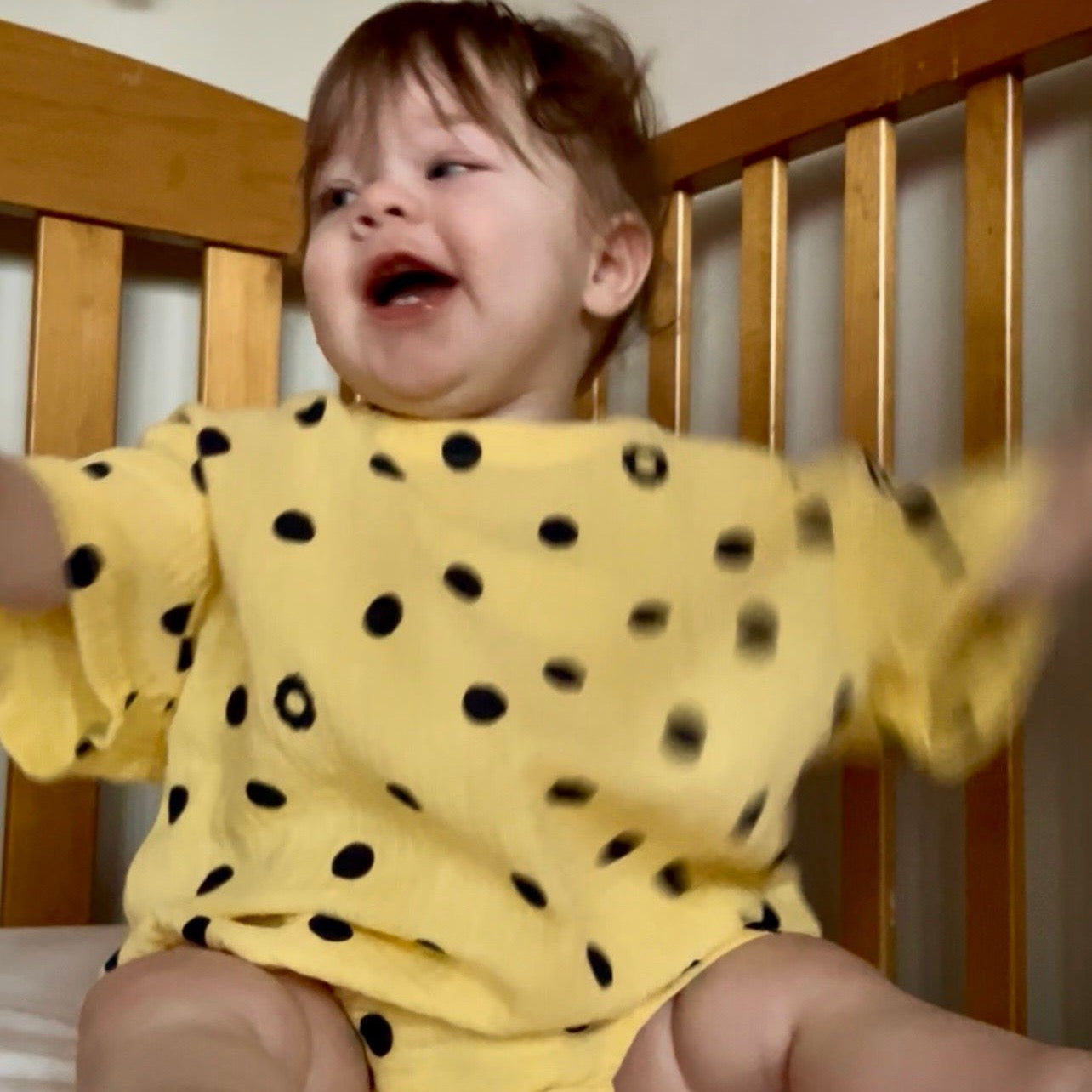 Vivi wearing Vivi Romper in Butter Dot. Age 6-12m • Wearing 6-12m