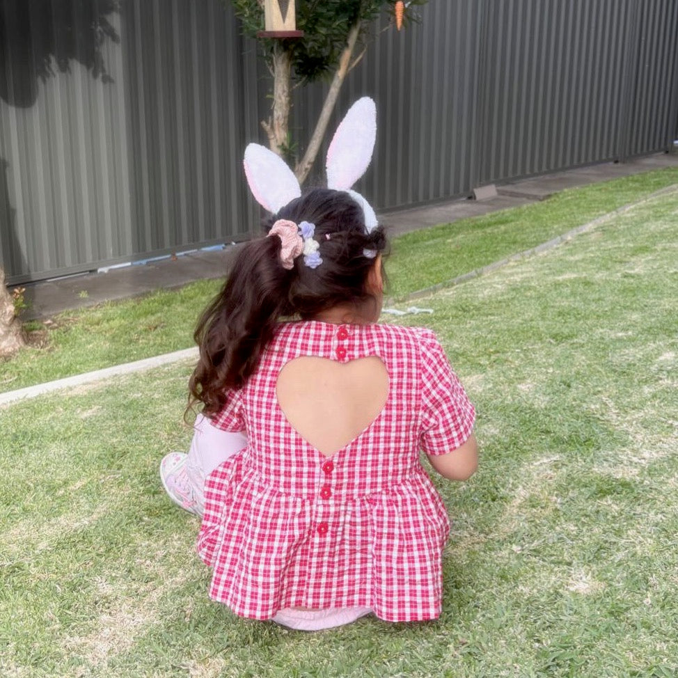 Ellie wearing Poppy Top in Ruby Check. Age 4 • Wearing 4-5Y