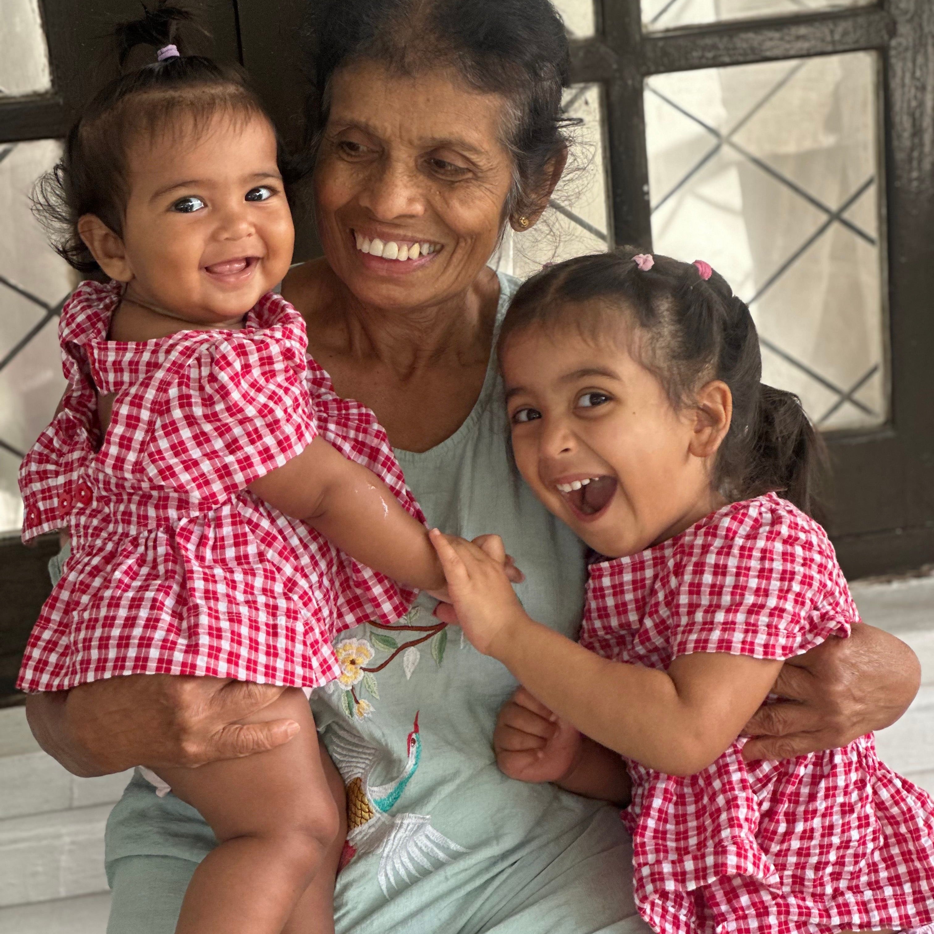 Dasha wearing Poppy Top in Ruby Check. Age 3 • Wearing 2-3Y