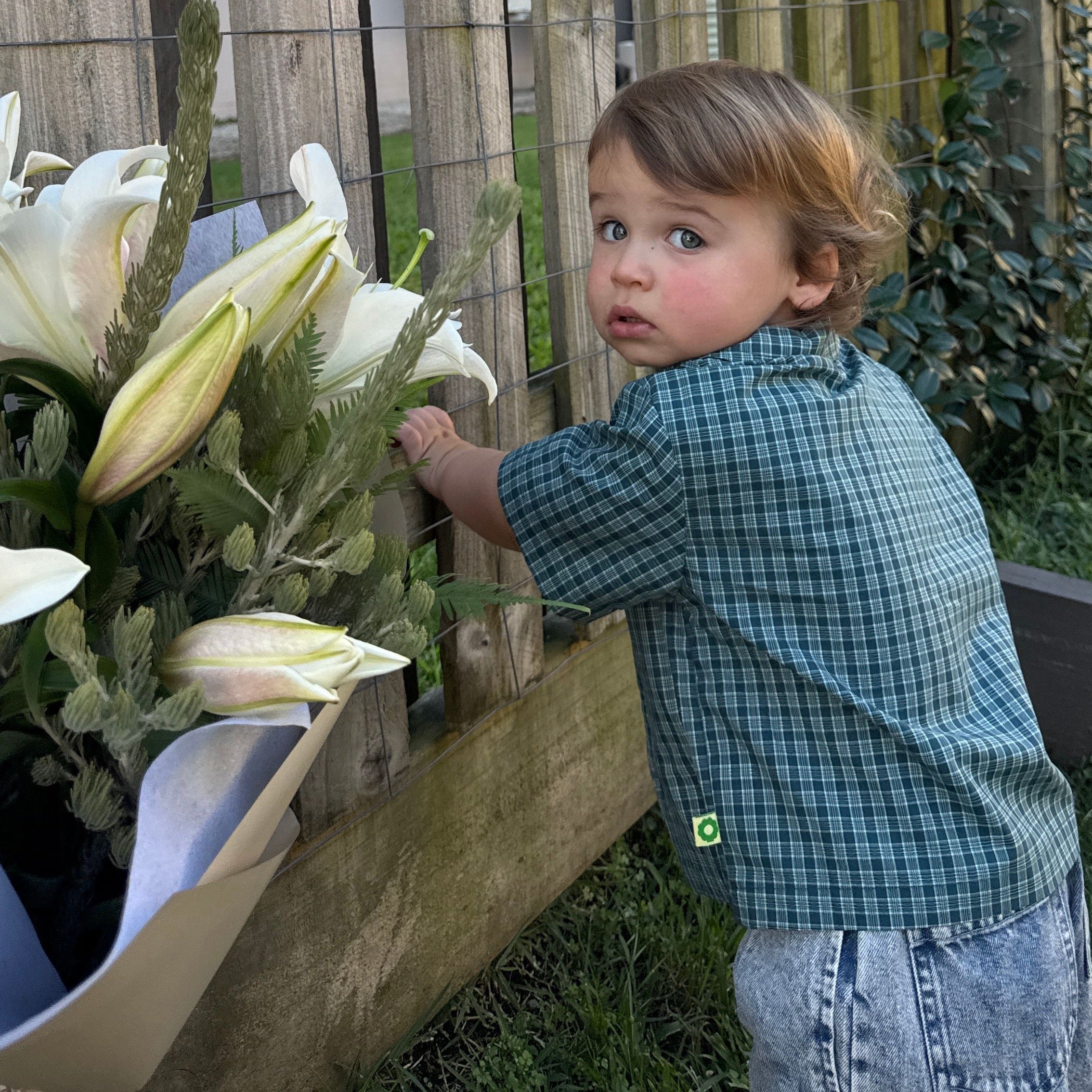 Huddy wearing Frankie Shirt in Stormy Check. Age 12-18m • Wearing 2-3Y