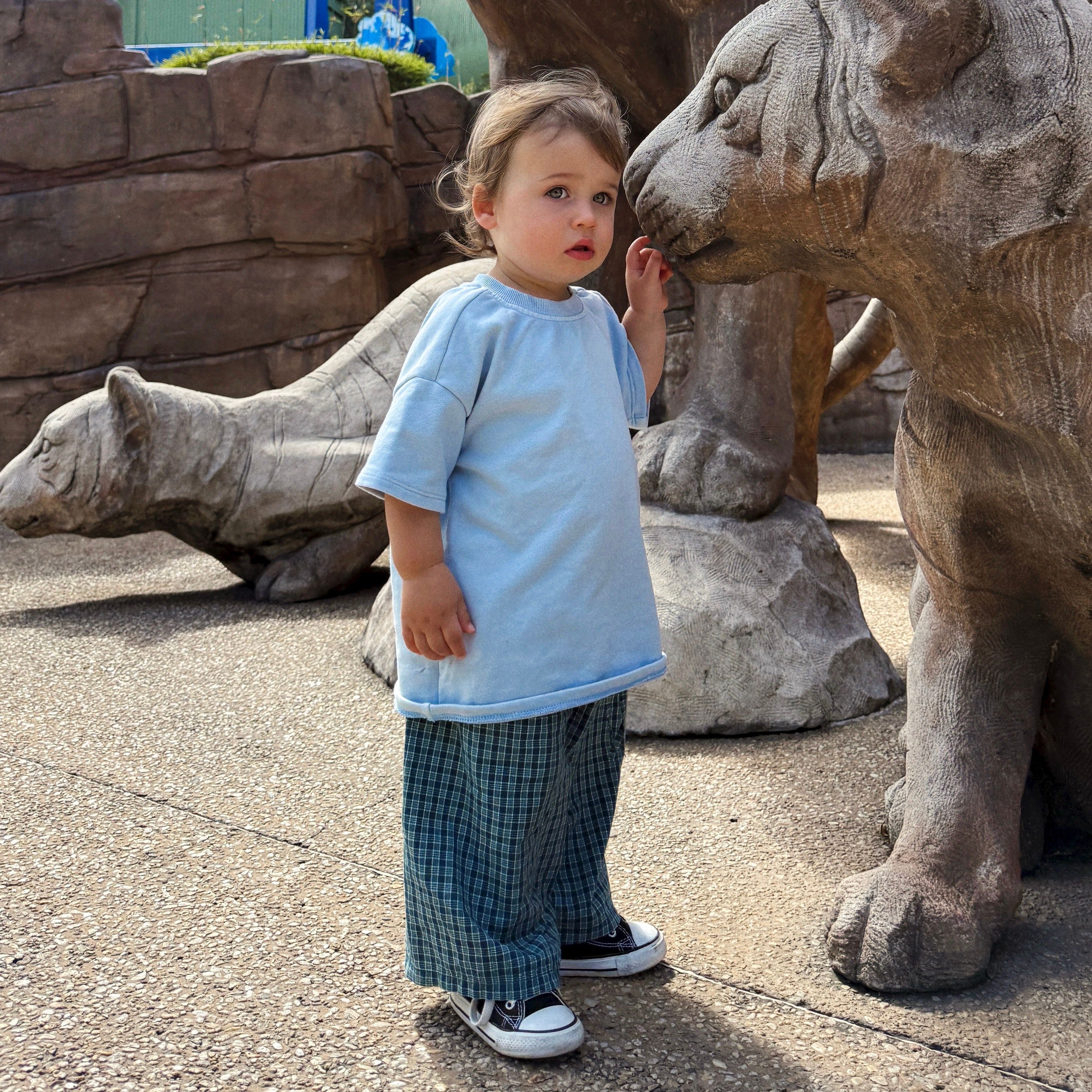 Huddy wearing Frankie Long Short in Stormy Check. Age 12-18m • Wearing 2-3Y