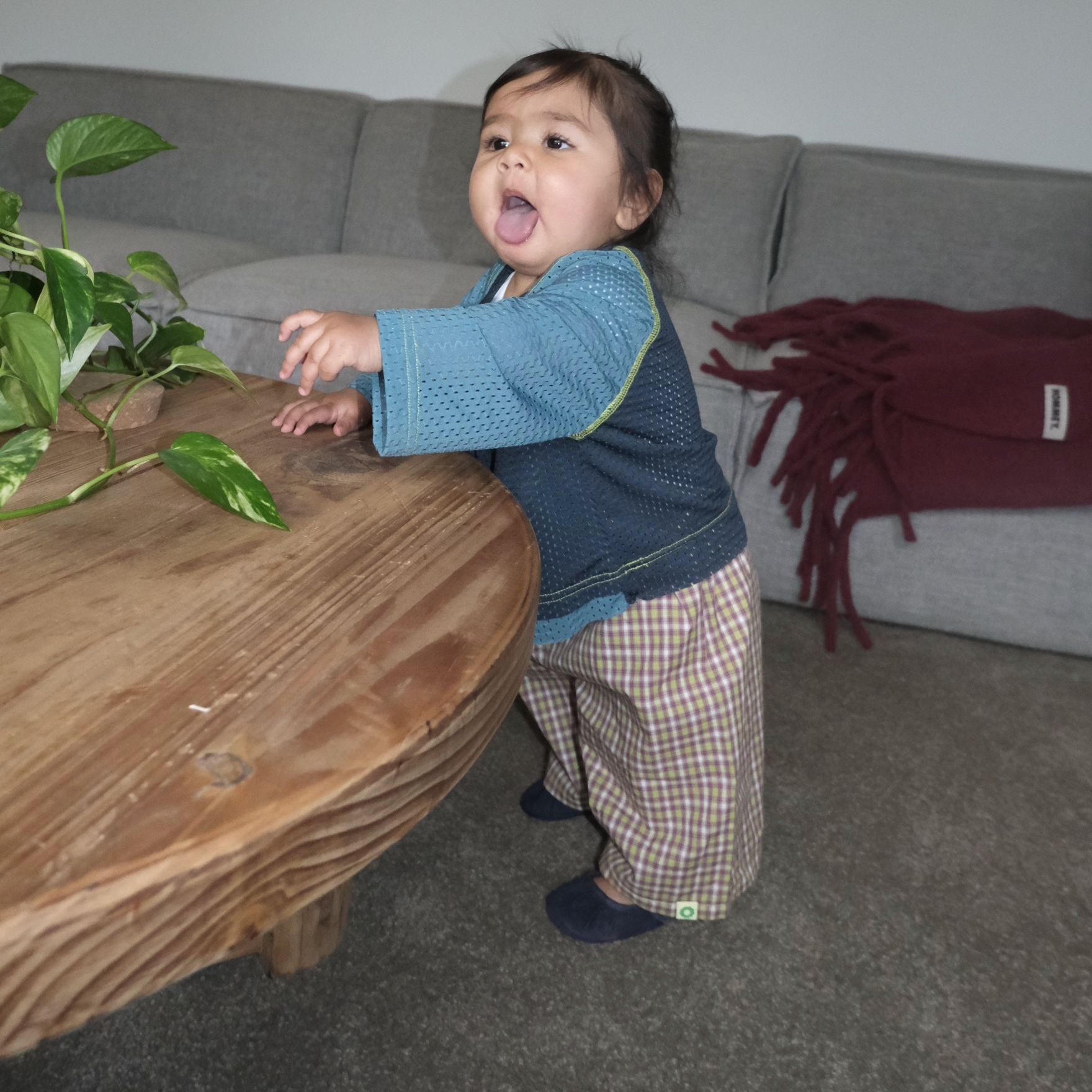 Ava wearing Frankie Long Short in Stormy Check. Age 6-12m • Wearing 6-12m