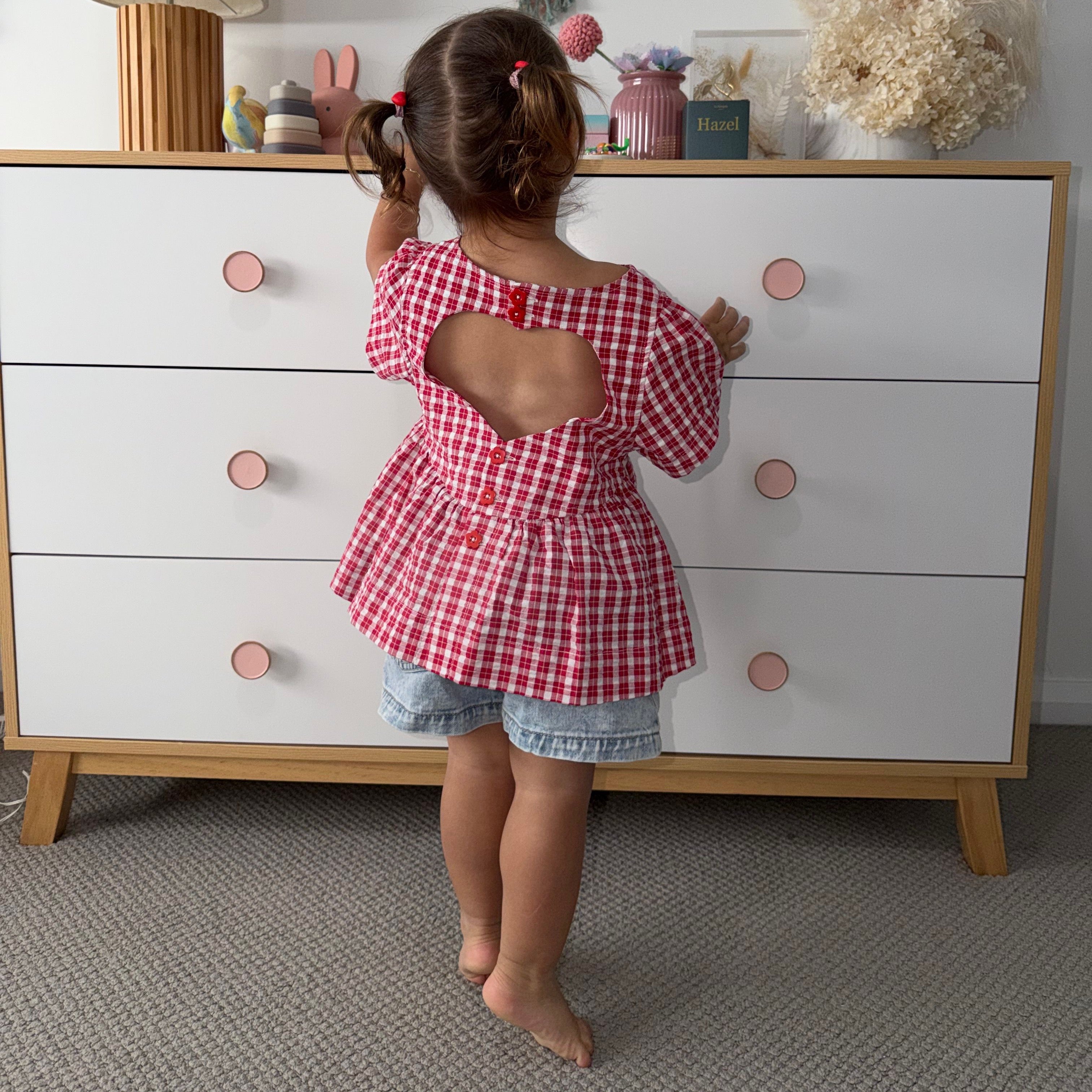 Hazel wearing Poppy Top in Ruby Check. Age 2 • Wearing 2-3Y