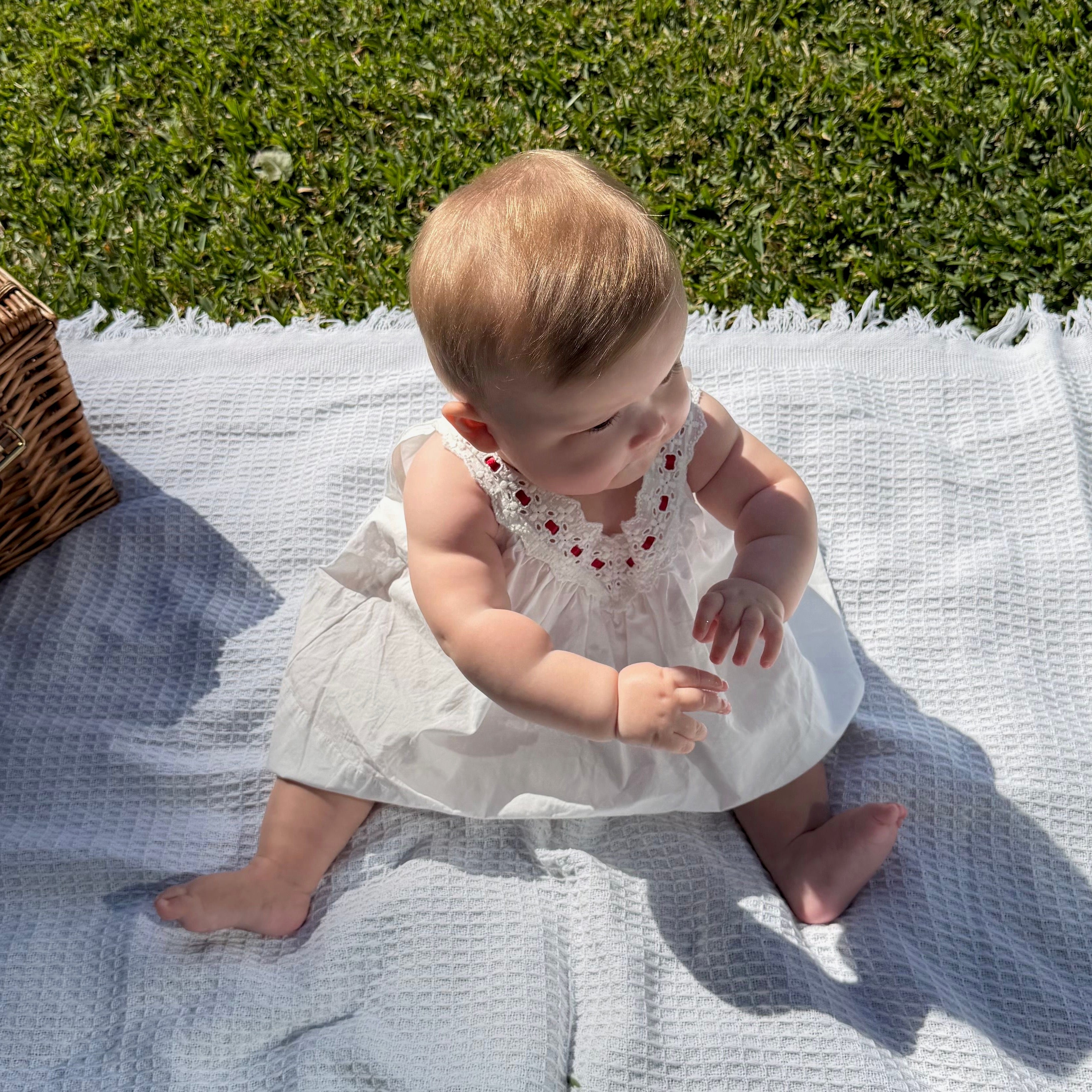 Alaya wearing Polly Dress in Coconut. Age 6-12m • Wearing 6-12m
